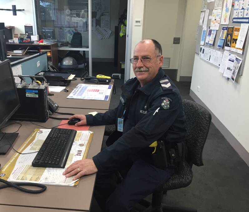 HARD AT WORK: Leading Senior Constable Mark Stevens at his desk in the Ararat Police Station.