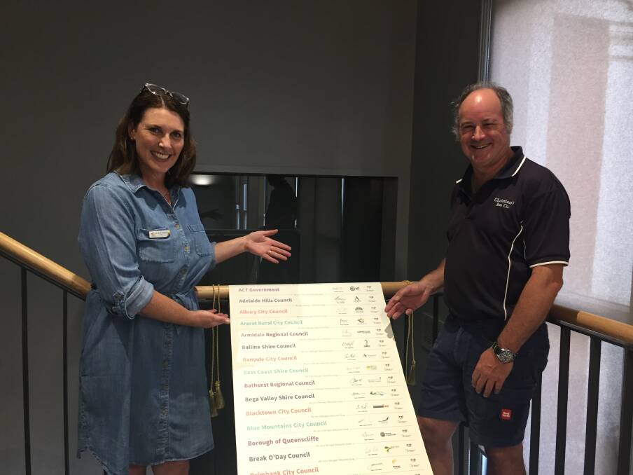 SIGNED UP: Ararat Rural City Council mayor Councillor Jo Armstrong and former mayor Paul Hooper with the Welcome Scroll. Picture: JESSIEANNE GARTLAN.