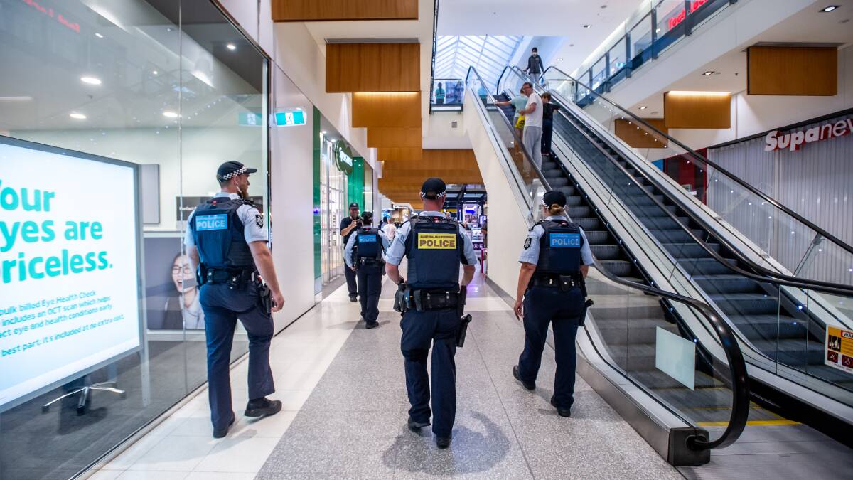 Police enforcing social distancing measures in the Canberra Centre in April. Picture: Karleen Minney