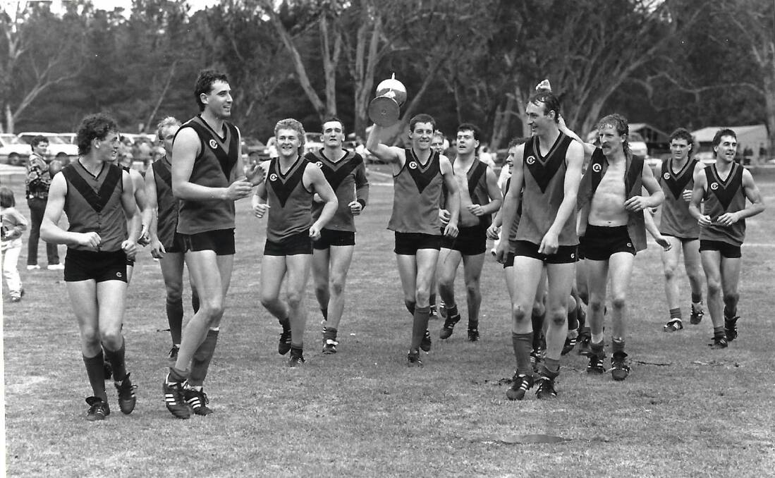 ALL SMILES: the 1987 Stawell premiership side celebrate at Dimboola after their victory. Liam Pickering booted five goals for the game, eventually ending up at AFL clubs North Melbourne and Geelong. Picture: CONTRIBUTED 