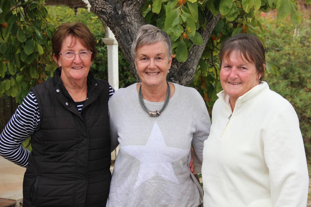 CLOSE KNIT: Rhonda Malcolm, Sue Young and Sue Gardner have been busy fundraising for Mrs Young's daughter's trip to Russia. Picture: LACHLAN WILLIAMS
