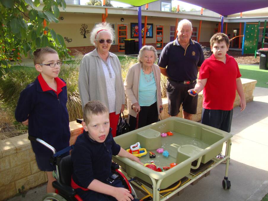 SENSORY TABLE: Skene Street students with Beth Anselmi and Joyce Dowsett (from the former SNWC) and Rotary president Des Pickford.