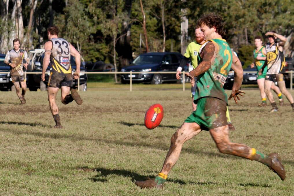 BATTLE: Navarre ruckman Rhett Murphy swings onto his left boot in wet and muddy conditions at home last week. With this week's game also at home, heavy ground conditions are again expected to be a factor. 