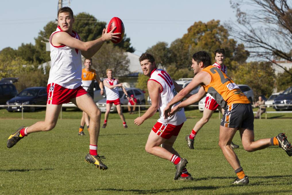 Ararat's Jacob Bates leaps to claim the ball in the qualifying final. Picture: PETER PICKERING