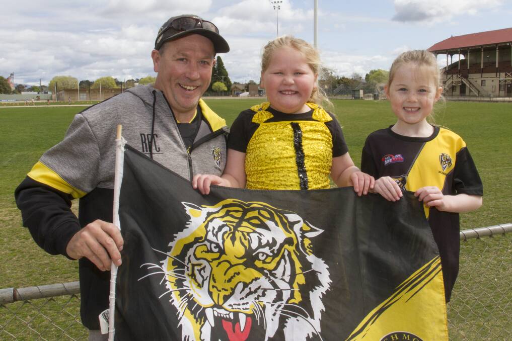 Mark St Clair, Lily-Rose and Zarli are hoping for another Richmond premiership. Picture: PETER PICKERING