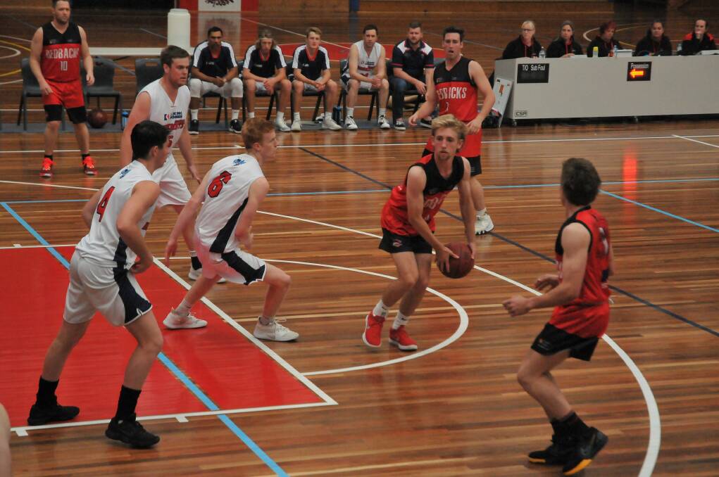 Ararat Redbacks' Will Lawrie looks to find a teammate against the Horsham Hornets. Picture: CASSANDRA LANGLEY