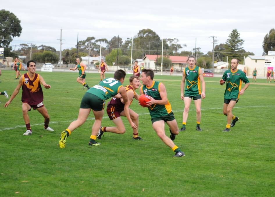Fraser Jennings runs the ball out of the pack for Dimboola. Picture: MATT CURRILL