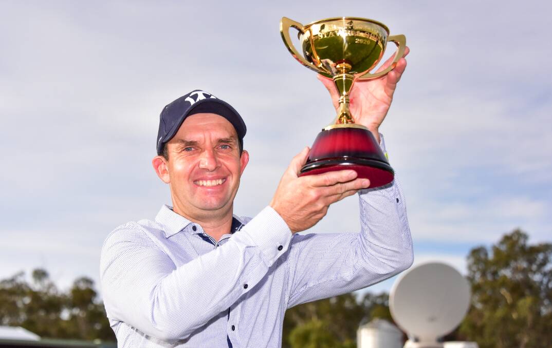 WINNER: Mark Pegus celebrates with the Stawell Cup.
Picture: BRENDAN MCCARTHY/RACING PHOTOS