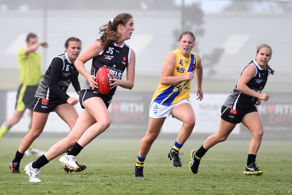 SURGE: Maggie Caris in action for the Rebels earlier this year. Picture: ADAM TRAFFORD