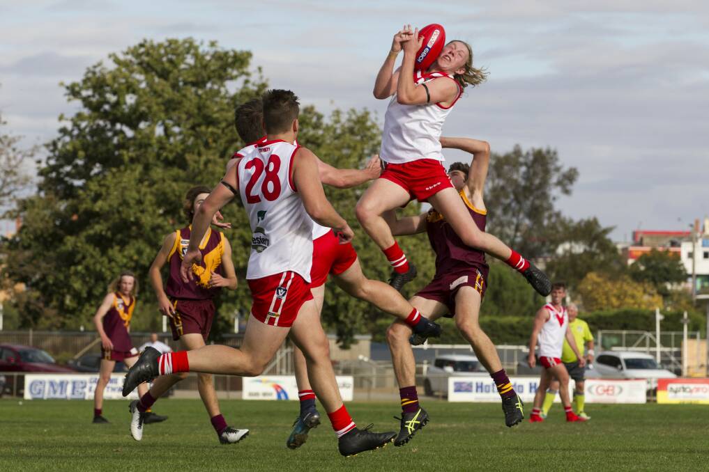Slocombe flies for a mark in the opening game of the 2019 season. 