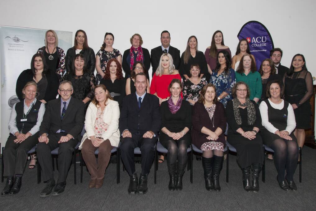 CELEBRATION: THe graduates, pictured in the back two rows, with trainers and guests at the 2018 Diploma of Nursing graduation. Picture: CONTRIBUTED