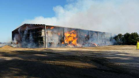 TRAGIC: A brand new hay shed up in flames at Avoca.