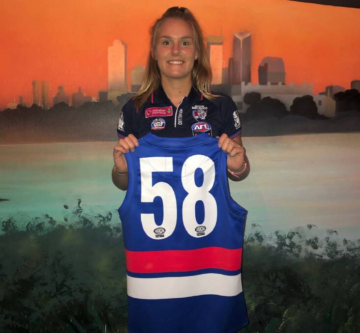 RECRUITED: Ella Wood receives her Western Bulldogs guernsey at the club's season launch in Melbourne on Wednesday night. Picture: CONTRIBUTED