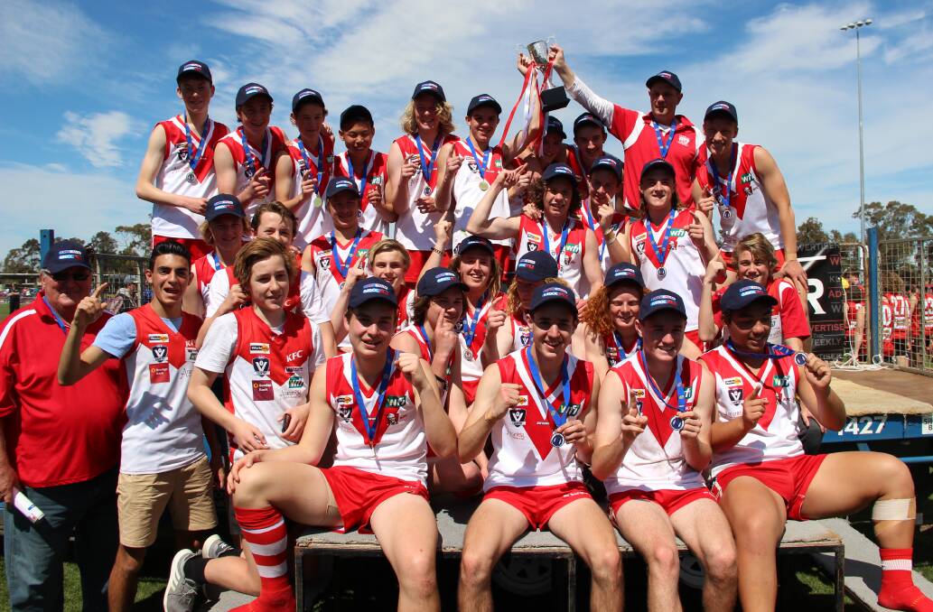 The Ararat Rats celebrate their 2018 under-17 football premiership. The Rats have remarkably won nine of the last 14 under-17 Wimmera Football League premierships. 