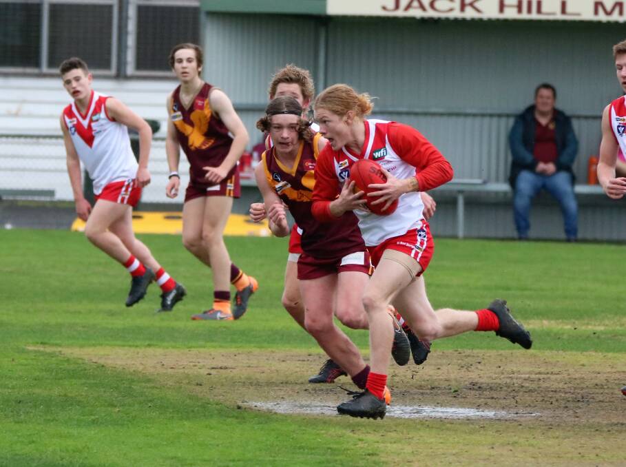 FULL FLIGHT: Ararat Rats' Jack Driscoll bursts away with the ball during an under-17s match last year. Picture: TERRI-ANNE LEWIS