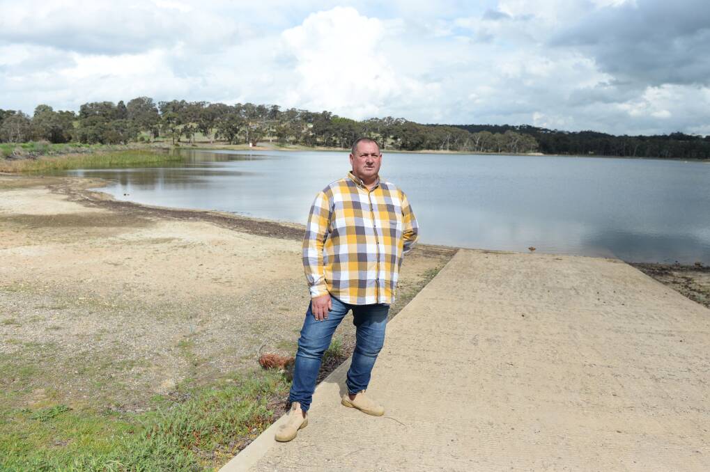 DROPPING: Goldfields Recreation Reserve caretaker Hank Owen has seen the water level at Beaufort Lake change throughout the years, but caravan park visitors keep coming back. Picture: Kate Healy 