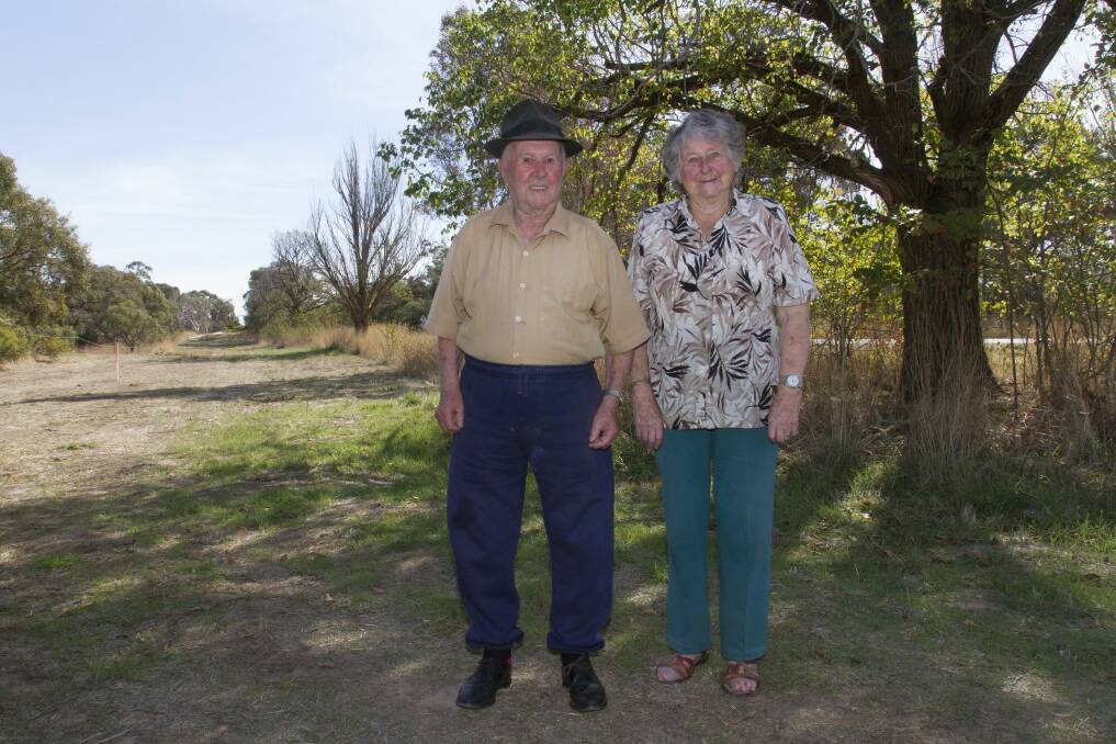 STORY OF SOLDIERS: Frank and June Schmidt at the Dobie Avenue of Honour, which is set for destruction for the Western Highway duplication. Few of the original 22 trees remain, but there's hope to save the original plaques. 
