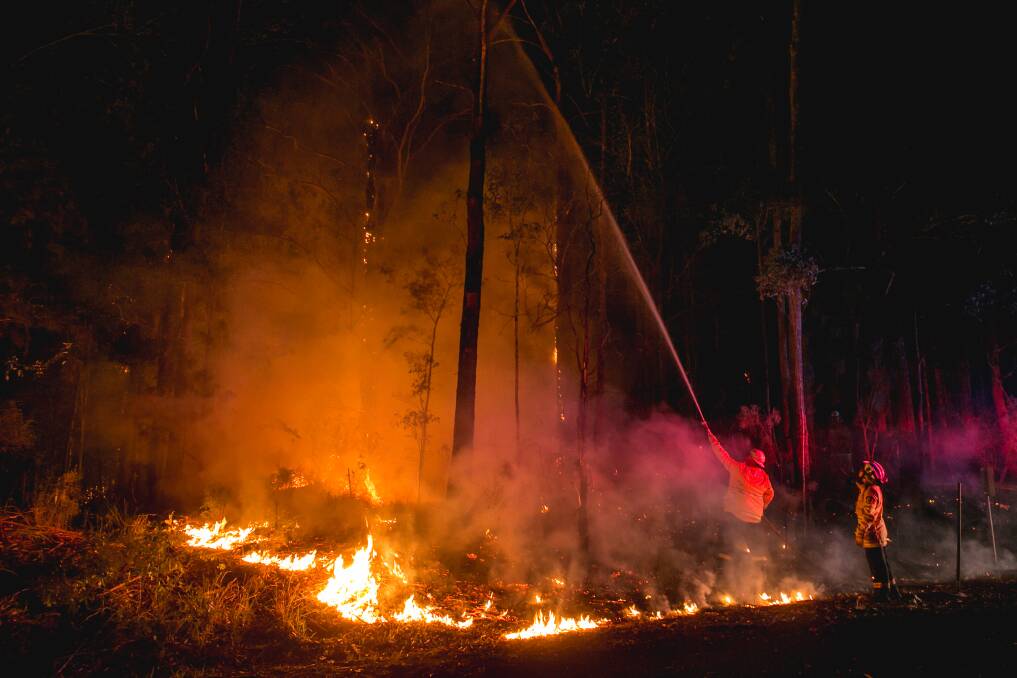 Rural Fire Service members fighting the flames around Martinsville. Picture: Marina Neil