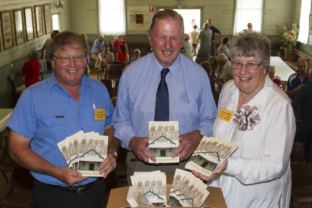 Moyston residents Neil Wilde, Ted Millear and Anne Marshall with the book launched to celebrate the Moyston Hall s centenary. Picture: PETER PICKERING