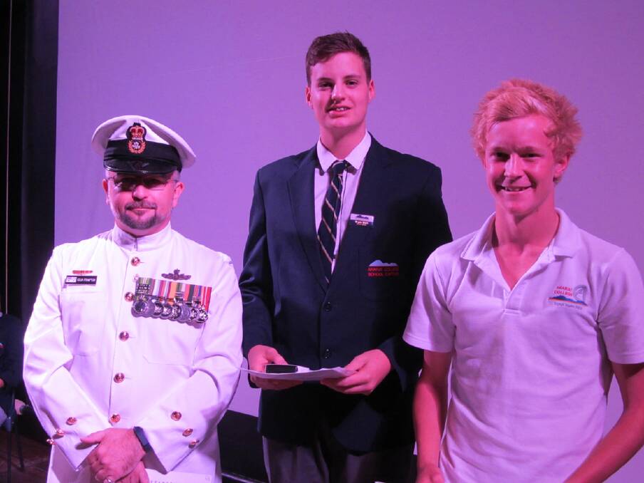 Chief Petty Officer Marine Technician Colin Frampton presenting Bryan Start and Riley Taylor the Defence Force Long Tan Award. Picture: CONTRIBUTED