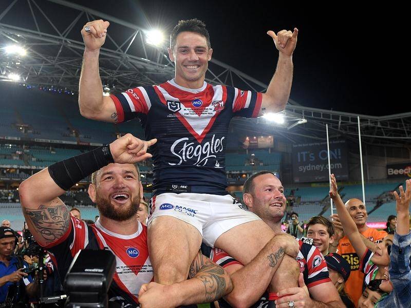 Retiring star Cooper Cronk is chaired off after the Roosters' Grand Final fin over the Raiders.