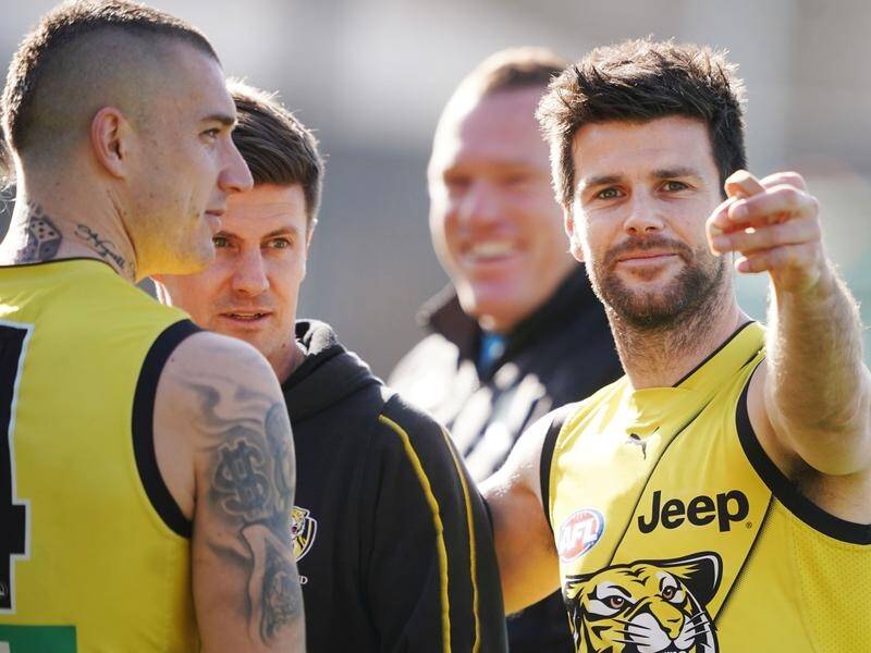 Tigers captain Trent Cotchin (R) looks set to return from injury for the crunch clash with Brisbane.