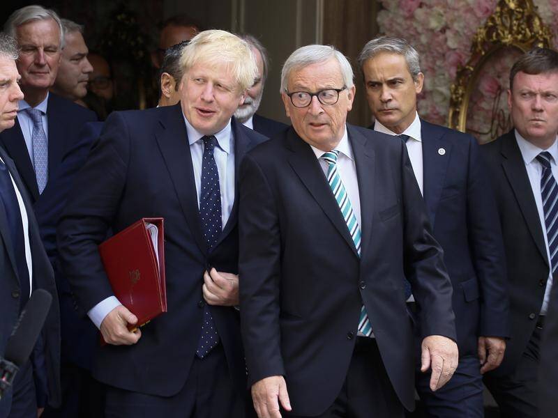 Boris Johnson (L) says a Brexit deal is shaping up but the EU says it's waiting for his proposals.