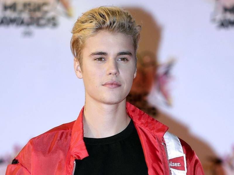 It's not yet known what prompted Justin Bieber to challenge Tom Cruise to a UFC fight.