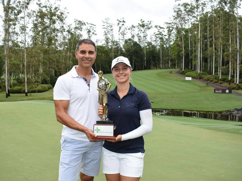 Stephanie Kyriacou and her father/caddie with the Australian Ladies Classic trophy in Bonville.