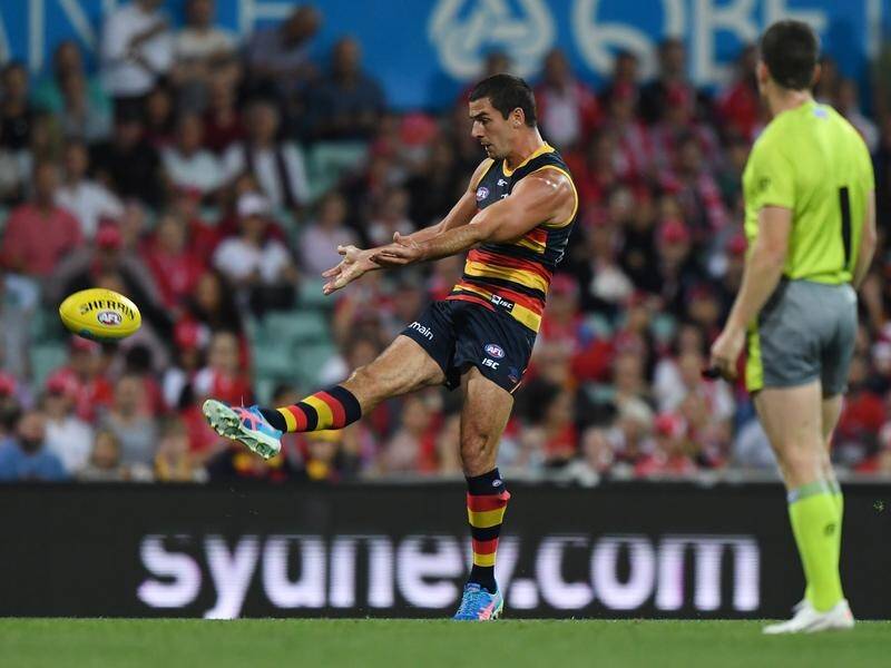 Adelaide captain Taylor Walker has kicked the Crows to a 10-point AFL win over Sydney.
