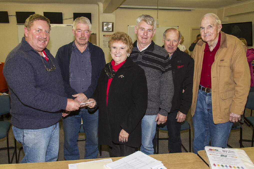 Green Hill Lake Development Board president Gwenda Allgood receives a cheque from Alan Culph with Tony Reynolds, Morrie Allgood, Phil Stapleton and Peter Daman.