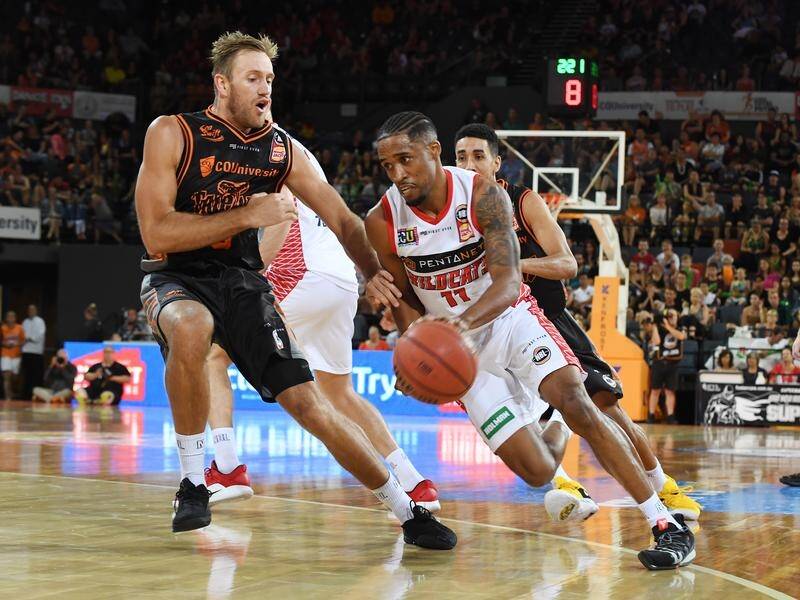 The Wildcats' Bryce Cotton (R) was top scorer against the Taipans but almost cost them the game.