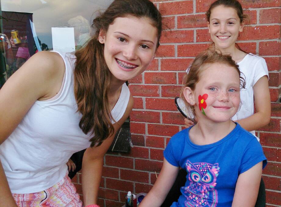Annabelle, Kate and Ruby during a face painting session.