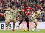 Athletic Bilbao's Inaki Williams (c) in action in his team's 1-1 draw with Granada in la Liga. (EPA PHOTO)