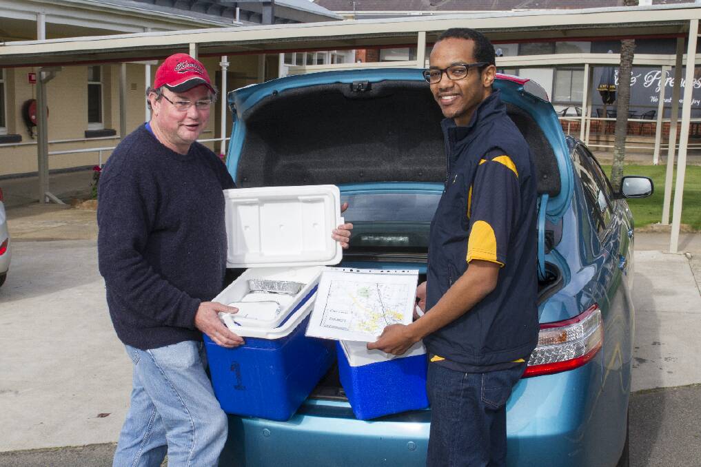 Loading up Meals On Wheels for the last time were Robert Murray and Ross Mohammed.
