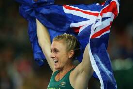 Gold Coast-based Sally Pearson celebrates winning gold.