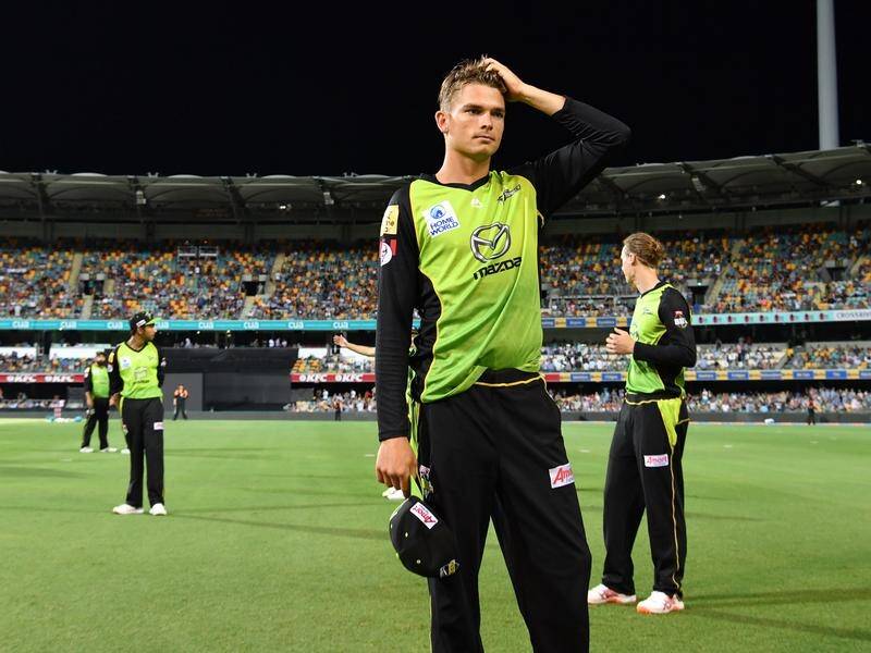 Frustrated Thunder players leave the field after the 'lights out' episode at the Gabba.