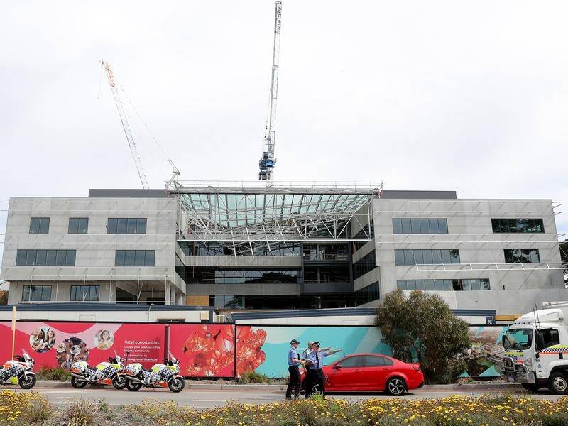 An apprentice has died after a building partially collapsed at Perth's Curtin University.