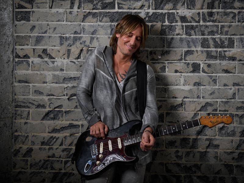 Country musician Keith Urban says his song, Female, is about much more than sexual harassment.