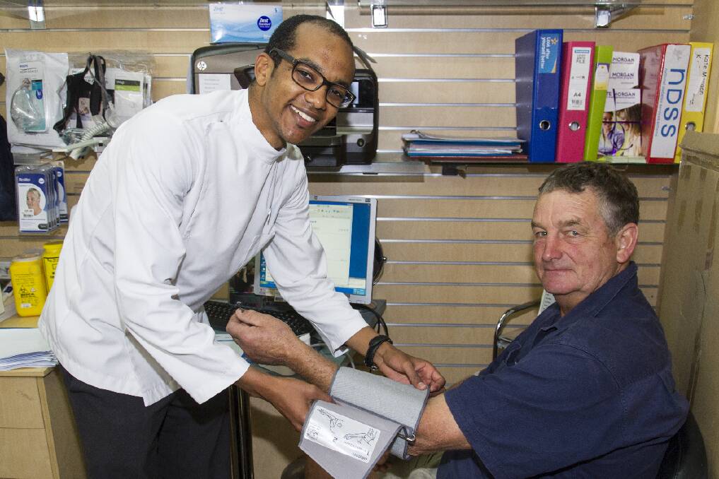 Ararat Chemmart s Ross Mohamed takes Joe Tucker s blood pressure. 
 Picture: PETER PICKERING