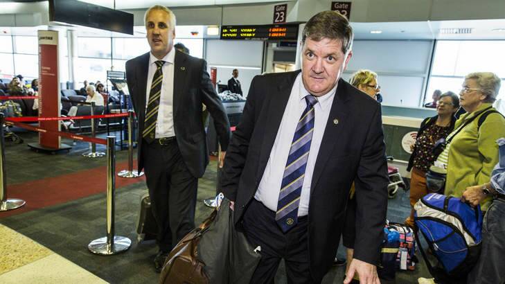 Detective Inspectors Mick Sheehy and Russell Oxford arrive at Brisbane Airport to question Roger Rogerson. Photo: Glenn Hunt
