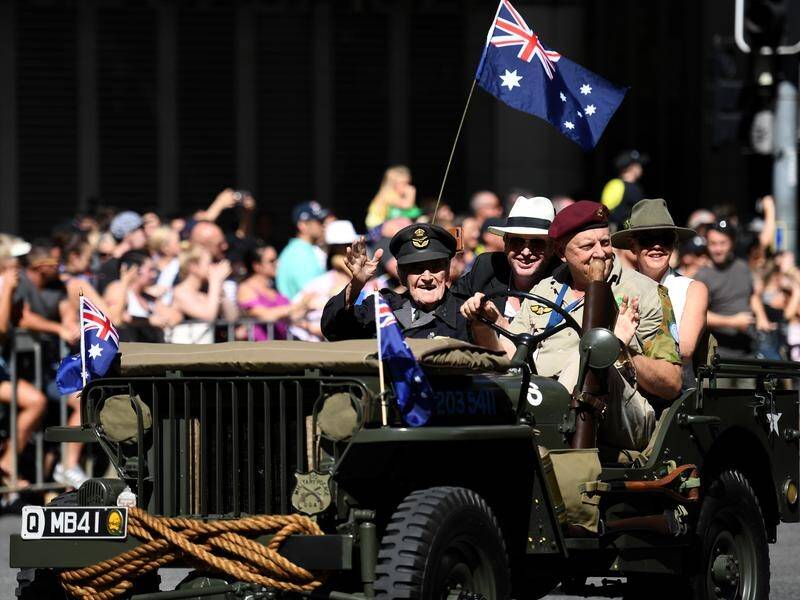 Thousands have gathered in central Brisbane to cheer on those taking part in the Anzac Day march.