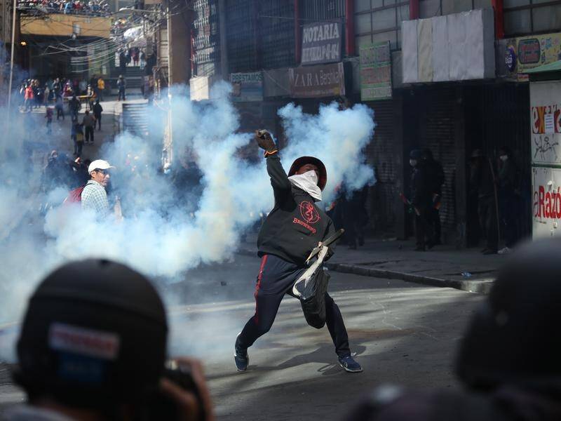Bolivia's government has asked Venezuelan nationals to leave and accused Cubans of stoking unrest.