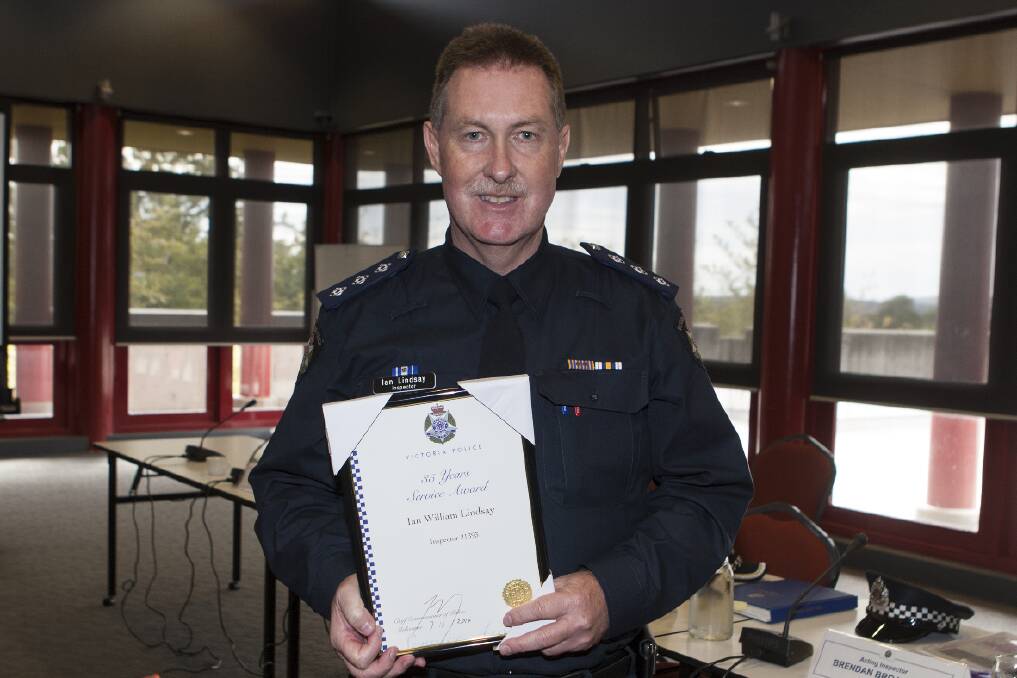 Inspector Ian Lindsay with his 35 year service award.