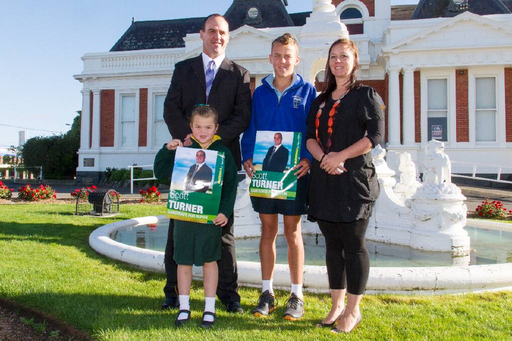 Ararat football identity Scott Turner will stand as The Nationals' candidate for the seat of Ripon in this year's State election. Scott is pictured with wife Kerri and children Pippa and Paddy at Thursday's announcement in Ararat by Deputy Premier Peter Ryan. Picture: PETER PICKERING 