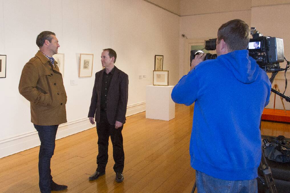 Ararat Regional Gallery, Anthony Camm (centre) being interviewed by Glen Moriarty (left) from Postcards. Picture: PETER PICKERING.