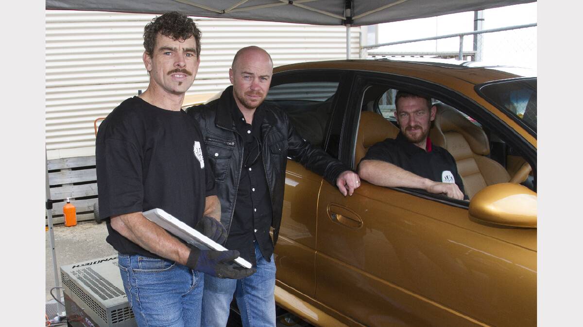 Mark Watson, Brad Connarty and Andrew Wells prepare to run a car on the dyno.