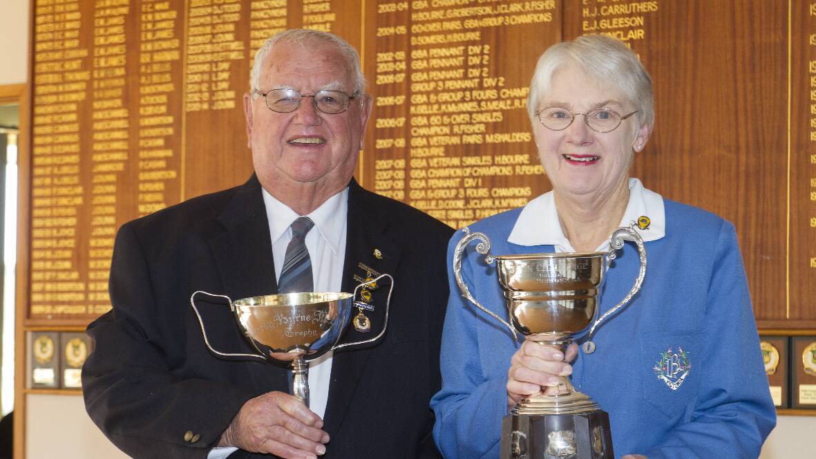 Ararat Bowls Club will celebrate its 130th anniversary this weekend. Pictured are presidents Jim Dunn and Lyn Jacobs holding the oldest trophies held by the club.
