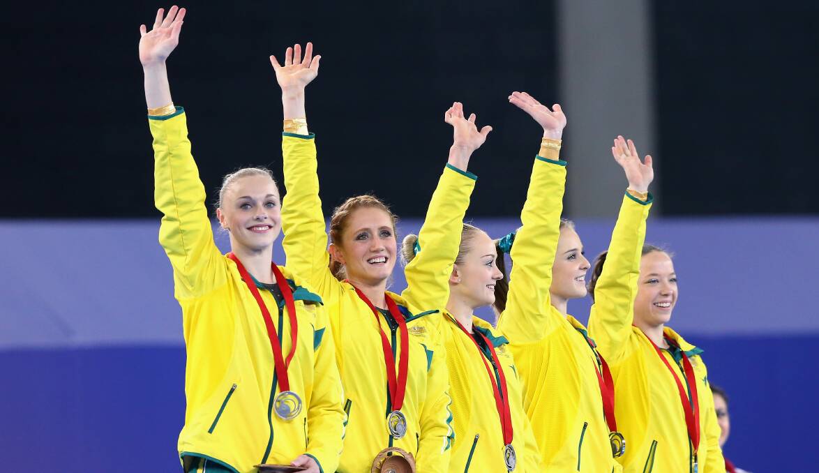 Georgia Rose Brown, Larrissa Miller, Lauren Mitchell, Olivia Vivian and Mary Anne Monckton of Australia receive their silver medals during the medal ceremony for the Women's Gymnastics Artistic Team Final. PICTURE: GETTY