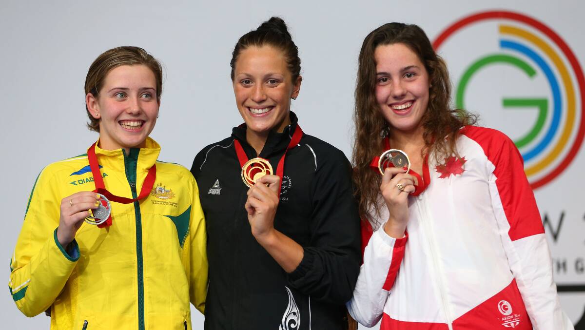 Gold medallist Sophie Pascoe of New Zealand poses with silver medallist Katherine Downie of Australia and bronze medallist Aurelie Rivard of Canada during the medal ceremony for the Women's 200m Individual Medley SM10 Final. PICTURE: GETTY